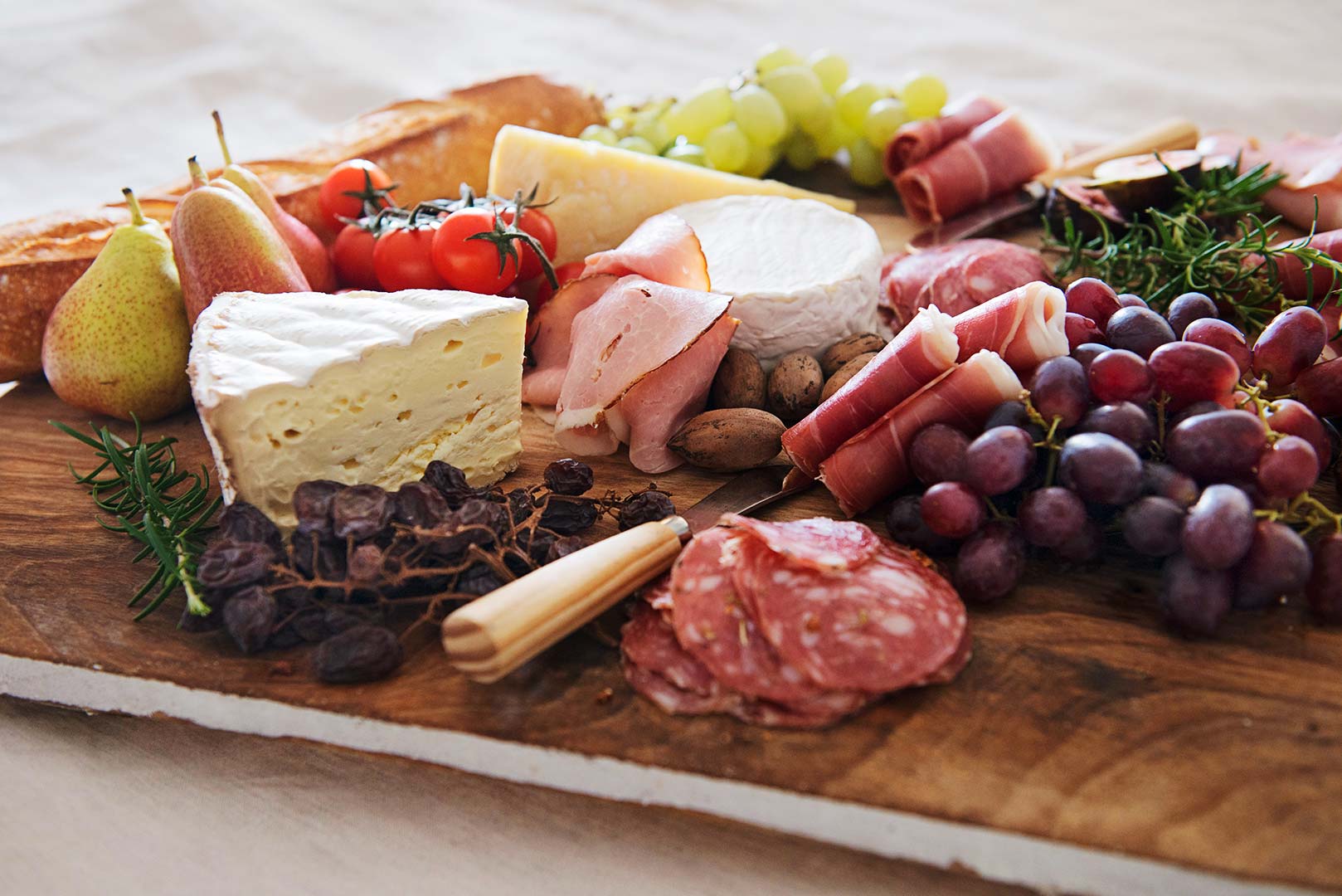 Delicious grazing board full of cheeses, cured meats & grapes, nuts etc from the food platter range 