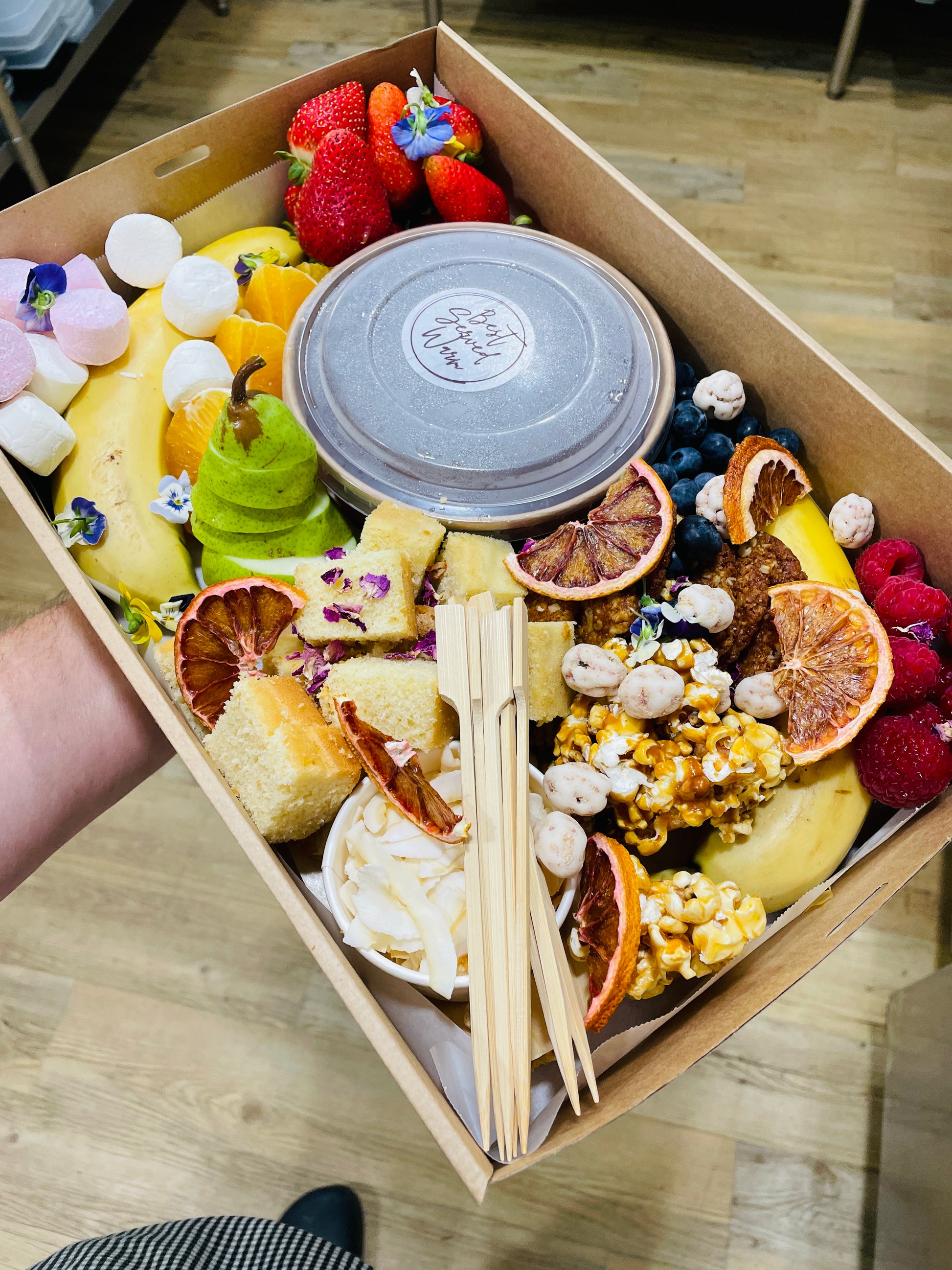 Melted dark chocolate fondue, fresh sponge, thick coconut flakes make your very own gourmet lamington. Tonnes of delicious in season fresh fruits plus caramel popcorn and marshmallows make this a perfect dessert grazing box