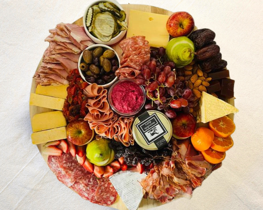 A mouth watering gourmet grazing platter of all Australian produce including cured meats, artisan cheeses with accompaniments like semi dried tomatoes, Australian olives & fresh honeycomb. Accompanied with sourdough breads, lavosh & crackers