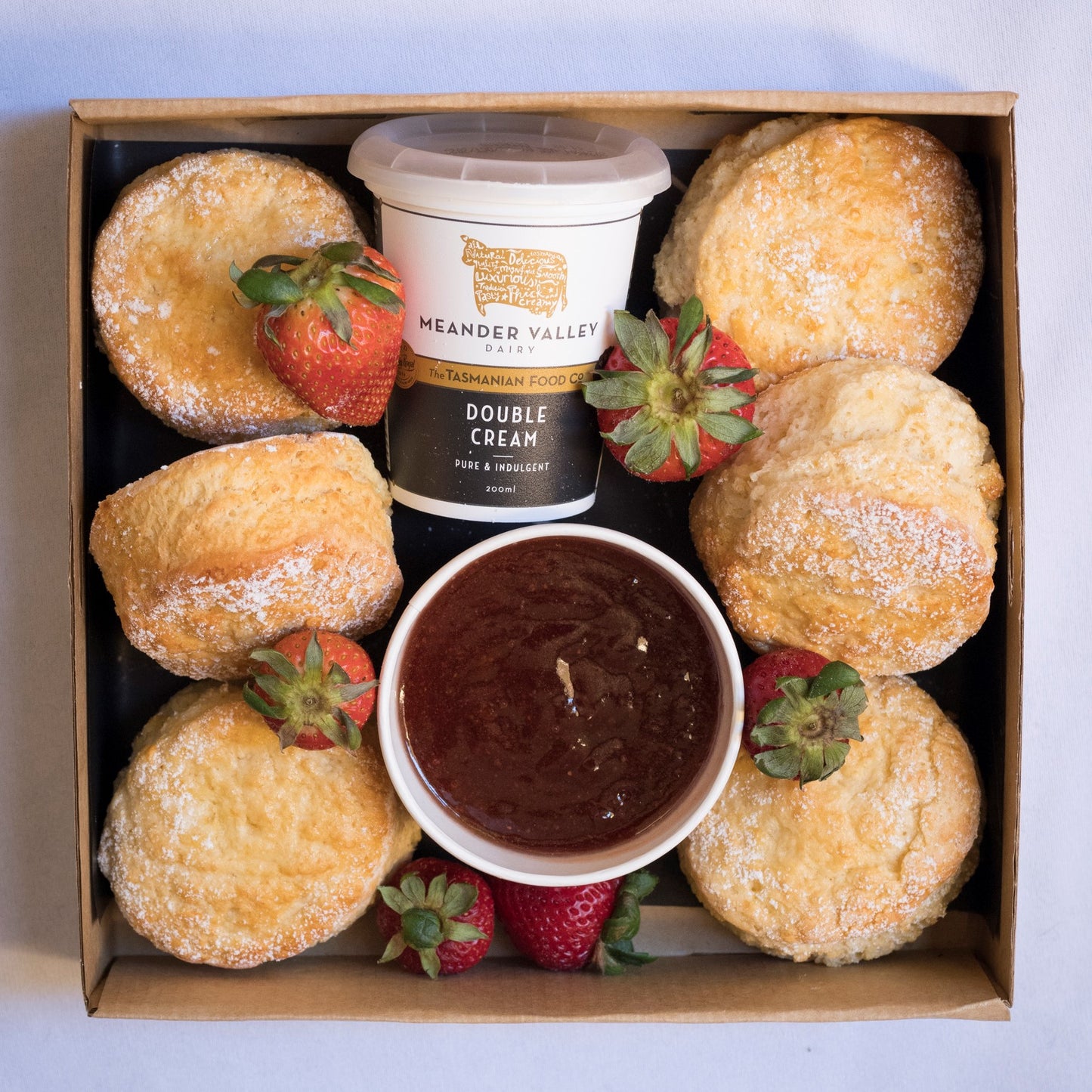 Light fluffy scones with Australia’s best cream, jam and fresh berries. We include Beerenberg strawberry jam & Meander Valley double cream. Just one of our dessert grazing boxes