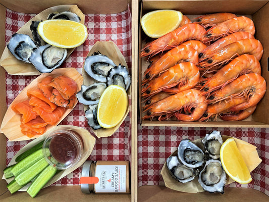A mouth watering gourmet seafood platter box of fresh Australian prawns oysters and Tasmanian smoked salmon. Complete with Beerenberg seafood sauce and homemade Mignonette dressing. Lemons & baby cucumber complete an awesome grazing box 