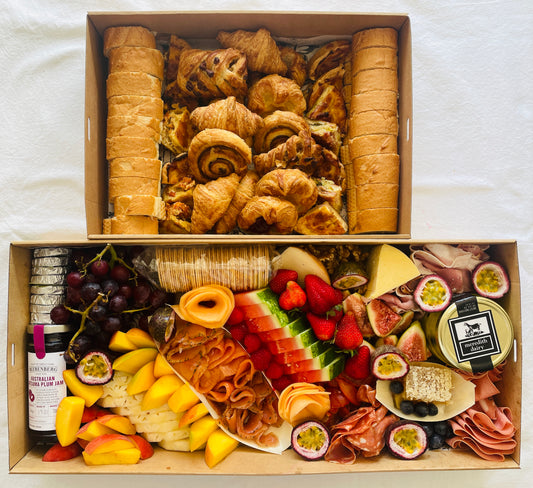 Gourmet brunch grazing box contains farmhouse cheeses, cured meats, smoked salmon, freshly baked danishes, croissants & quiches. Fresh seasonal fruits complete the box and includes, honey butter & Beerenberg jam 
